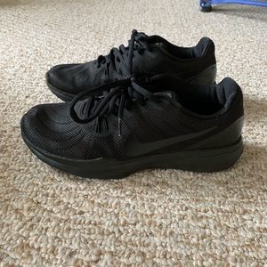 Black NIKE trainers